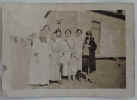 Mamie Shep Doughty Robbins, Essie Lewis, Mary Ellen Simpson, Mary Riggen, Hallie Smith, Fannie Bell, Hilda Tittermary, child unknown.  In front of Aunt Fanny's house on Hog Island.